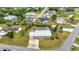 A nice aerial shot of a lovely single story home with backyard screened lanai, beautiful yard, and private driveway at 2236 Arnet St, Port Charlotte, FL 33948