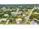 Expansive aerial view of a home nestled in a lush community with tree-lined streets and mature landscaping at 2236 Arnet St, Port Charlotte, FL 33948