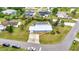 A nice aerial shot of a lovely single story home with backyard screened lanai, beautiful yard, and private driveway at 2236 Arnet St, Port Charlotte, FL 33948