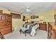 Relaxing bedroom with a ceiling fan, ample closet space, and wood furnishings at 2236 Arnet St, Port Charlotte, FL 33948