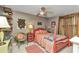 Comfortable bedroom with a ceiling fan, charming decor, and ample space for relaxation at 2236 Arnet St, Port Charlotte, FL 33948