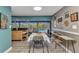 Open dining area featuring access to the bright kitchen and screened-in pool with views of the backyard at 2236 Arnet St, Port Charlotte, FL 33948