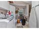 Functional laundry room featuring a washing machine, storage and a small window at 2236 Arnet St, Port Charlotte, FL 33948