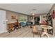 Comfortable living room with stylish decor, including wood-look floors, and art, creating a welcoming ambiance at 2236 Arnet St, Port Charlotte, FL 33948
