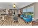 Spacious living room featuring stylish furnishings, wood-look flooring, and an abundance of natural light at 2236 Arnet St, Port Charlotte, FL 33948