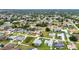 Panoramic aerial view of a community featuring numerous homes with well-kept lawns and mature trees at 23104 Turnbull Ave, Port Charlotte, FL 33954