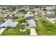 Aerial view showcases home with landscaped yard, complementing the neighborhood's residential charm at 23104 Turnbull Ave, Port Charlotte, FL 33954