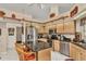 Spacious kitchen featuring stainless steel appliances, granite countertops, and a central island with seating at 23104 Turnbull Ave, Port Charlotte, FL 33954
