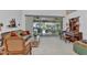 Cozy living room with large windows overlooking the pool and backyard at 23104 Turnbull Ave, Port Charlotte, FL 33954
