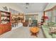 Inviting living room with comfortable seating, open floor plan, and access to the kitchen at 23104 Turnbull Ave, Port Charlotte, FL 33954