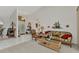 Bright living room featuring tile floors, high ceilings, and a decorative pelican wall hanging at 23104 Turnbull Ave, Port Charlotte, FL 33954