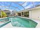 Beautiful screened-in pool with a spa and plenty of space for lounging at 23104 Turnbull Ave, Port Charlotte, FL 33954