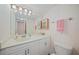 Updated bathroom with marble vanity top, ample lighting and storage cabinet space at 23465 Harborview Rd # 925, Punta Gorda, FL 33980