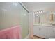 Well-maintained bathroom featuring a shower with glass doors and vanity sink with storage at 23465 Harborview Rd # 925, Punta Gorda, FL 33980