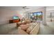 Bright living room with sliding doors opening to a screened-in lanai at 23465 Harborview Rd # 925, Punta Gorda, FL 33980