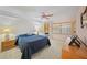 Bright main bedroom with a ceiling fan, neutral tones, and natural light at 23465 Harborview Rd # 925, Punta Gorda, FL 33980