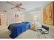 Comfortable main bedroom with ensuite bath and ceiling fan at 23465 Harborview Rd # 925, Punta Gorda, FL 33980