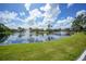 Enjoy the tranquil pond view from the lush green lawn at 23465 Harborview Rd # 925, Punta Gorda, FL 33980