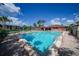 Inviting pool with lounge chairs and umbrellas, perfect for relaxation and social gatherings at 23465 Harborview Rd # 925, Punta Gorda, FL 33980