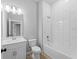 Bathroom featuring a tiled shower-tub combo, white vanity and a toilet at 2354 Bonanza Ln, North Port, FL 34286