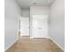 Bedroom showcases a closet for ample storage, modern tile flooring, and neutral paint at 2354 Bonanza Ln, North Port, FL 34286