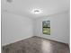 Bright bedroom with tile floors and a window overlooking a serene outdoor view at 2372 Bonanza Ln, North Port, FL 34286
