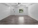 The living room features fresh neutral paint and attractive tile flooring at 2372 Bonanza Ln, North Port, FL 34286