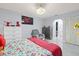 Bedroom featuring tile floors, neutral walls, a ceiling fan and an adjacent closet at 25068 Harborview Rd # 1B, Punta Gorda, FL 33980