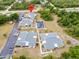 Aerial view of the community showcasing well-maintained buildings, pool, and parking at 25068 Harborview Rd # 1B, Punta Gorda, FL 33980