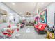 Bright living room with stylish furniture, fireplace, and a view into the kitchen at 25068 Harborview Rd # 1B, Punta Gorda, FL 33980