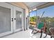 Enclosed patio with screened windows and tiled floors at 25068 Harborview Rd # 1B, Punta Gorda, FL 33980