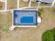 Aerial view of screened-in pool with surrounding lounge area at 25068 Harborview Rd # 1B, Punta Gorda, FL 33980