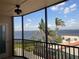 Balcony view showcasing palm trees and water views at 25188 Marion Ave # F307, Punta Gorda, FL 33950