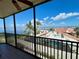 Balcony view showcasing the neighboring rooftops and beautiful water views at 25188 Marion Ave # F307, Punta Gorda, FL 33950