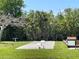 A second view of the bocce ball court with benches surrounded by tropical landscaping in a well maintained community at 25188 Marion Ave # F307, Punta Gorda, FL 33950