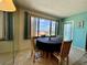 Features a dining room with water views, a round table, and comfortable bamboo chairs at 25188 Marion Ave # F307, Punta Gorda, FL 33950