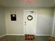 Condo front door with wreath, welcome mat, and decor creating a warm, inviting entry at 25188 Marion Ave # F307, Punta Gorda, FL 33950