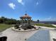 Charming gazebo nestled in a beautifully landscaped park with waterfront views, ideal for relaxation at 25188 Marion Ave # F307, Punta Gorda, FL 33950