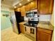 The kitchen has stainless steel appliances and granite countertops at 25188 Marion Ave # F307, Punta Gorda, FL 33950