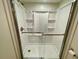 Clean step-in shower featuring a clear sliding glass door at 25188 Marion Ave # F307, Punta Gorda, FL 33950