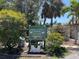 Entrance to the community tennis courts with lush landscaping and well-maintained facilities at 25188 Marion Ave # F307, Punta Gorda, FL 33950