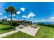 Picturesque waterfront park with picnic tables, benches, and a charming gazebo for gatherings at 25188 Marion Ave # F307, Punta Gorda, FL 33950