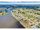 Aerial view of a lakeside community with beautiful homes and lush landscapes at 25319 Vantage Ln, Punta Gorda, FL 33983
