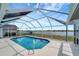 Enjoy relaxing in this screened-in pool and lanai with peaceful lake views at 25319 Vantage Ln, Punta Gorda, FL 33983