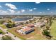Overhead view of a condo community with manicured grounds near a lake, highlighting the tranquil setting at 26396 Nadir Rd # 507, Punta Gorda, FL 33983