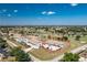 Aerial view of condo community near a golf course, showcasing its well-maintained exteriors and proximity to amenities at 26396 Nadir Rd # 507, Punta Gorda, FL 33983