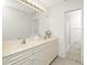 Bathroom with dual sinks and a vanity, providing a functional and well-lit space at 26396 Nadir Rd # 507, Punta Gorda, FL 33983