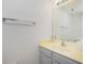 Bathroom features a single sink, a vanity, a large mirror with vanity lighting, and towel bar at 26396 Nadir Rd # 507, Punta Gorda, FL 33983