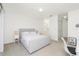 Cozy bedroom featuring modern furnishings, carpet and an en suite bathroom at 26396 Nadir Rd # 507, Punta Gorda, FL 33983