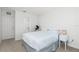 Serene bedroom with a comfortable bed and view of the bathroom at 26396 Nadir Rd # 507, Punta Gorda, FL 33983